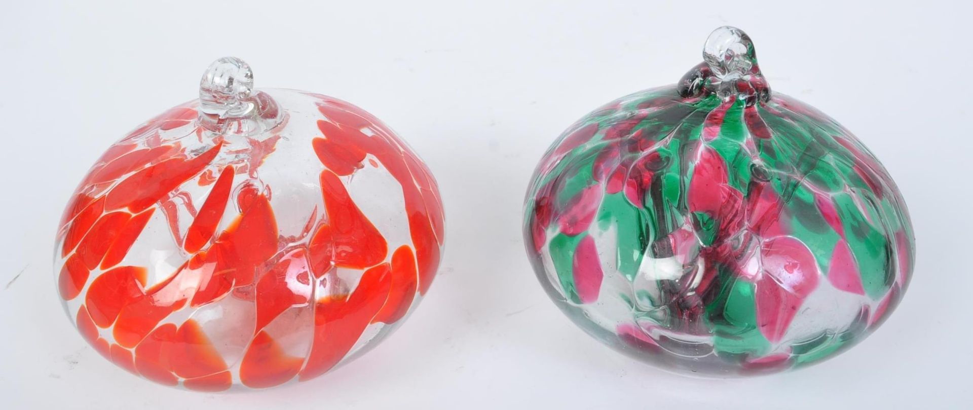 PAIR OF GLASS OBLATE SPHEROID HANGING BALLS