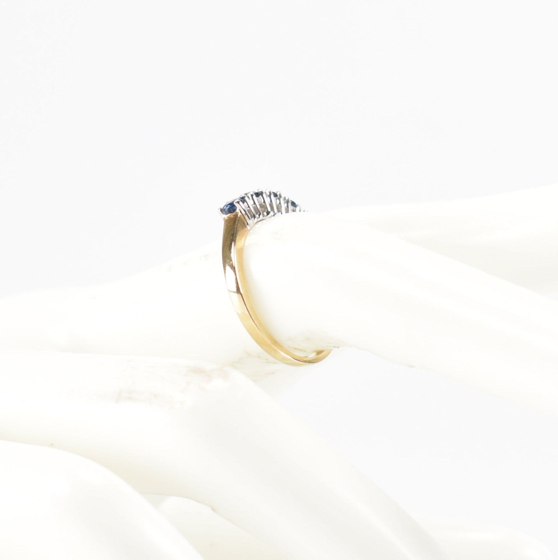 A hallmarked 9ct gold sapphire and diamond half eternity ring. The ring set with five round mixed - Image 9 of 9