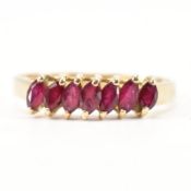 GOLD & RUBY SEVEN STONE RING