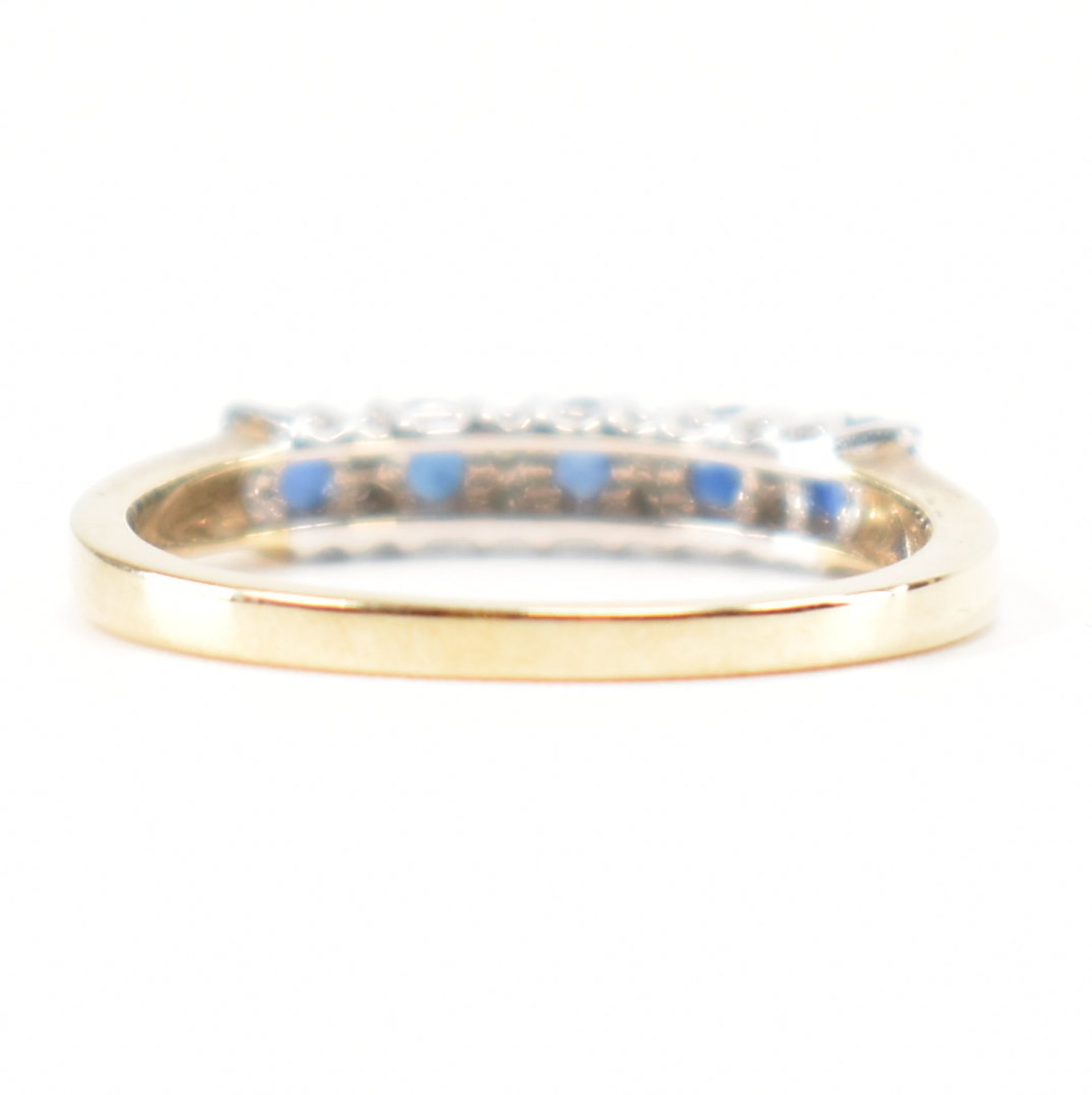 A hallmarked 9ct gold sapphire and diamond half eternity ring. The ring set with five round mixed - Image 4 of 9