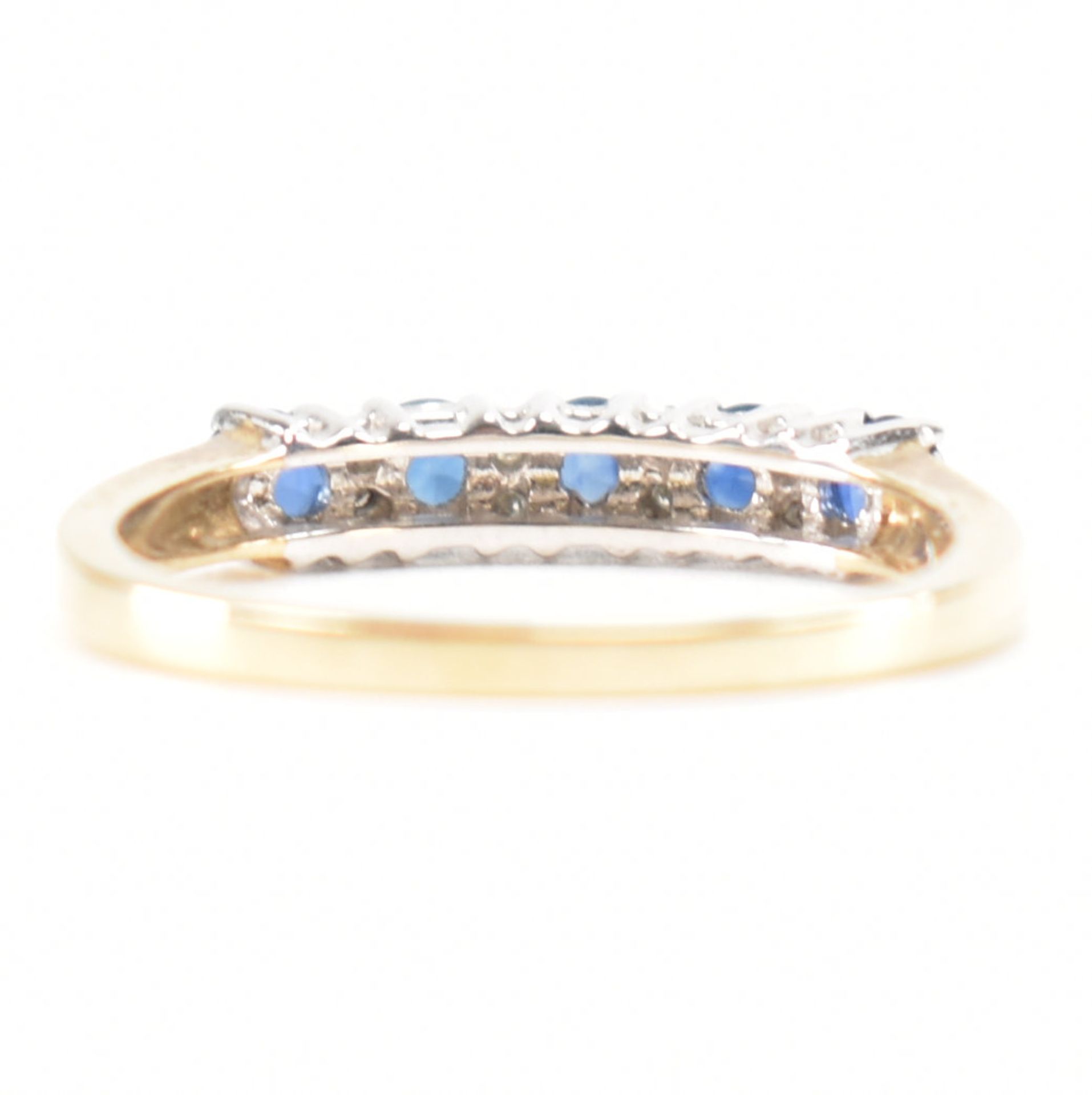 A hallmarked 9ct gold sapphire and diamond half eternity ring. The ring set with five round mixed - Image 3 of 9