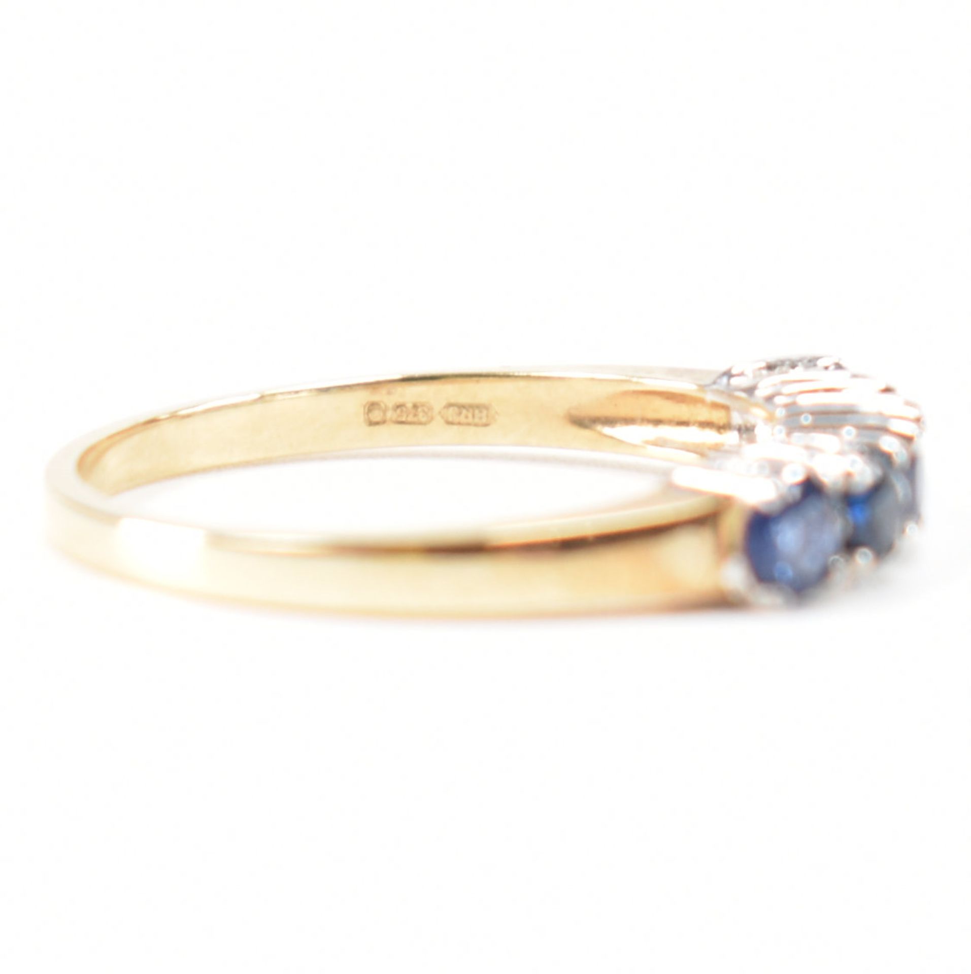 A hallmarked 9ct gold sapphire and diamond half eternity ring. The ring set with five round mixed - Image 6 of 9
