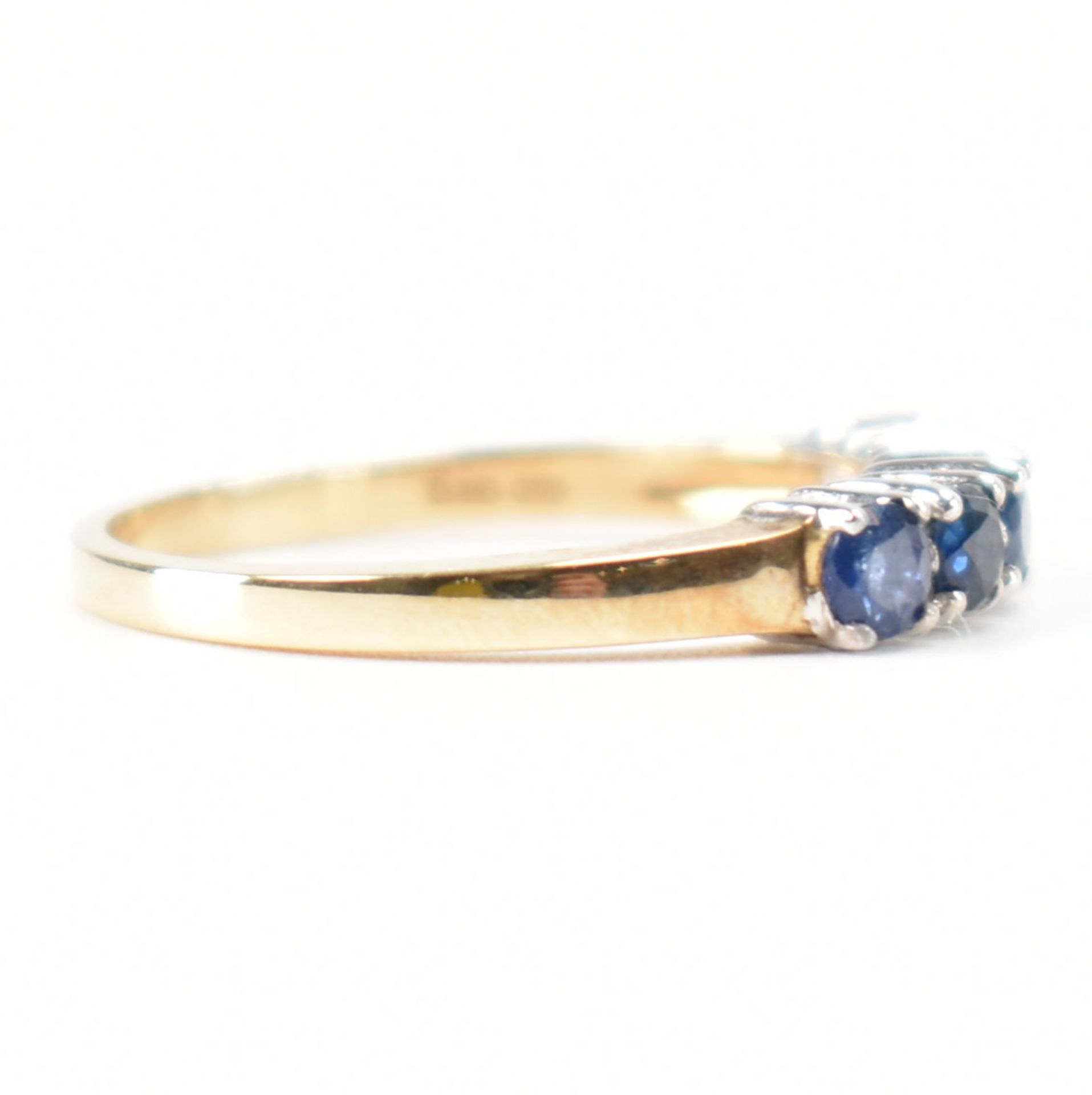 A hallmarked 9ct gold sapphire and diamond half eternity ring. The ring set with five round mixed - Image 5 of 9