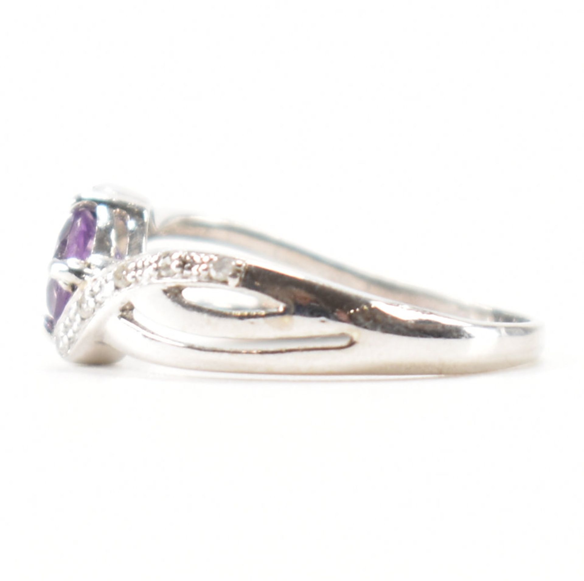 HALLMARKED 9CT WHITE GOLD AMETHYST & DIAMOND CROSSOVER RING - Image 2 of 9