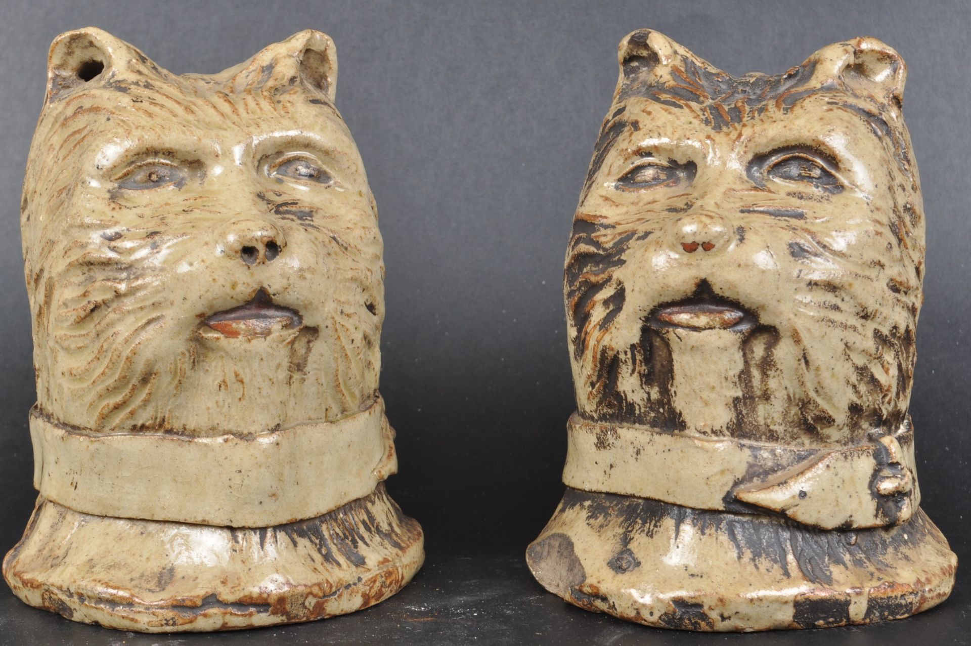 A MATCHING PAIR OF 19TH CENTURY CLAY CAT MONEY BOXES