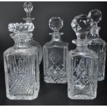 FIVE VINTAGE CUT GLASS DECANTERS - INCLUDING STUART CRYSTAL