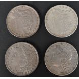 FOUR 19TH CENTURY AMERICAN SILVER MORGAN DOLLAR COINS