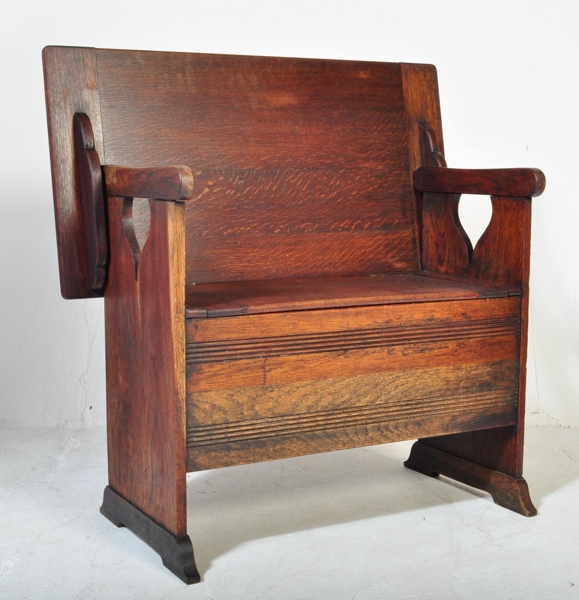 1920S JACOBEAN REVIVAL MAHOGANY MONK'S BENCH SETTLE