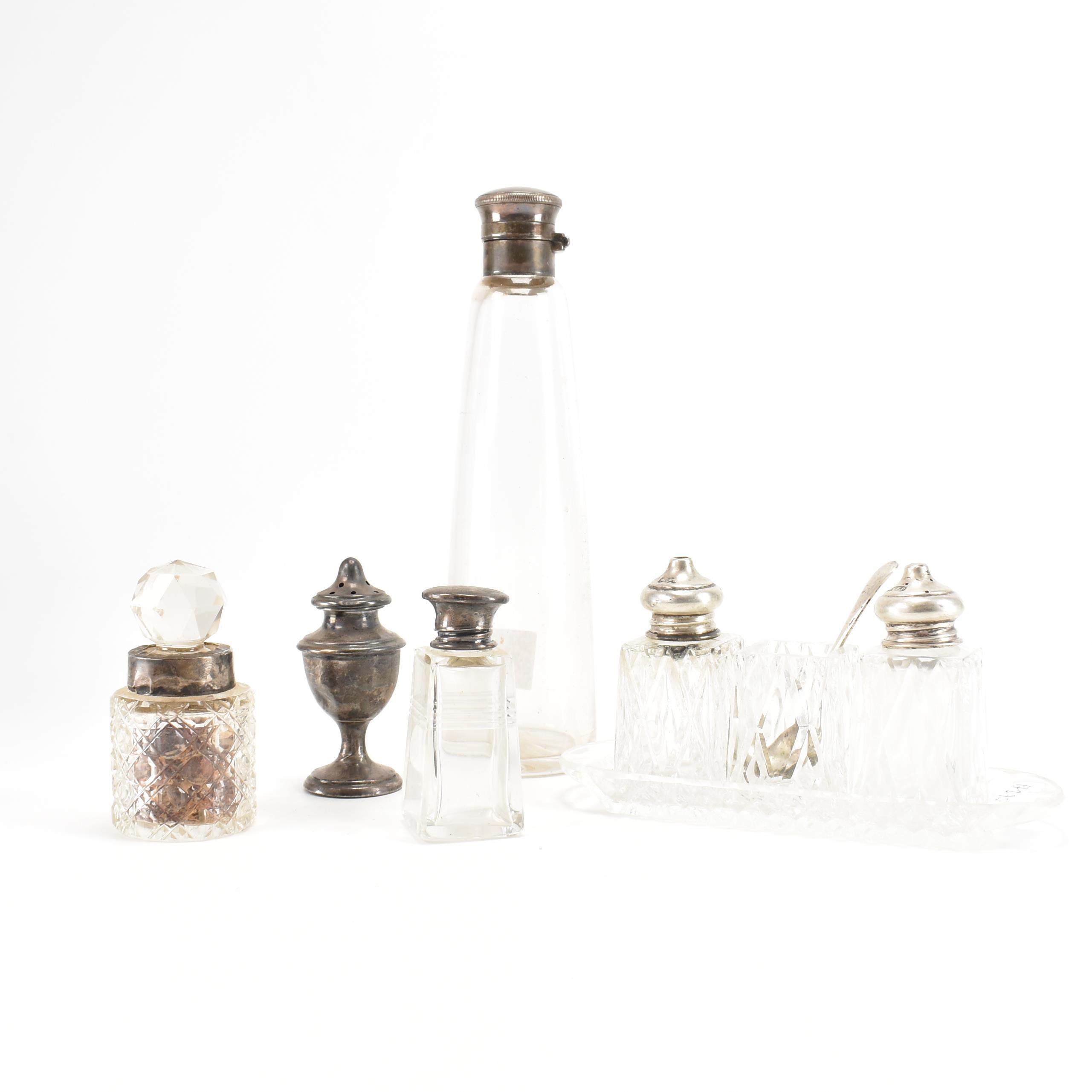 A COLLECTION OF SILVER & GLASS HALLMARKED CONDIMENT POTS SHAKERS & TRAYS