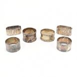 COLLECTION OF SIX SILVER AND SILVER PLATE NAPKIN RINGS