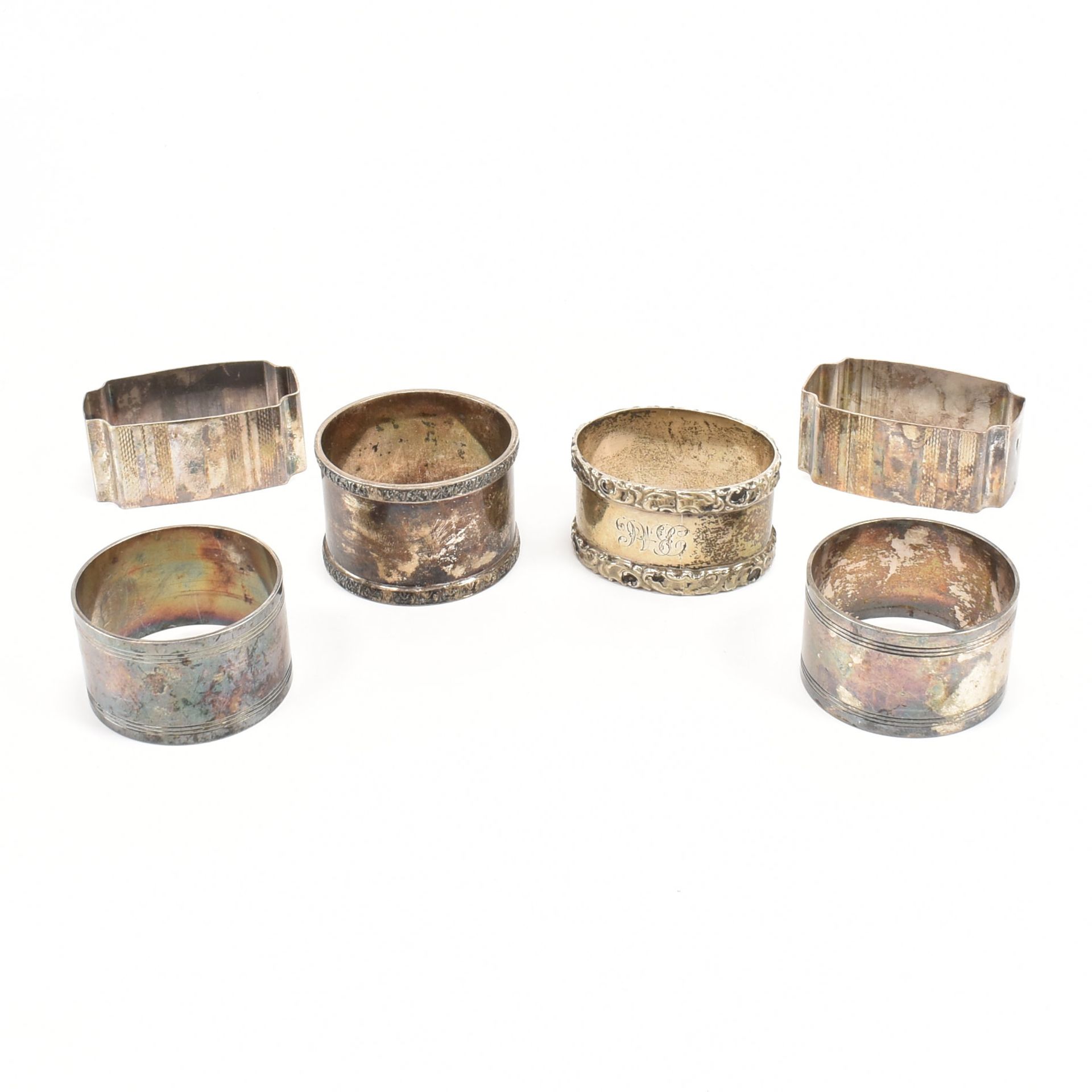 COLLECTION OF SIX SILVER AND SILVER PLATE NAPKIN RINGS