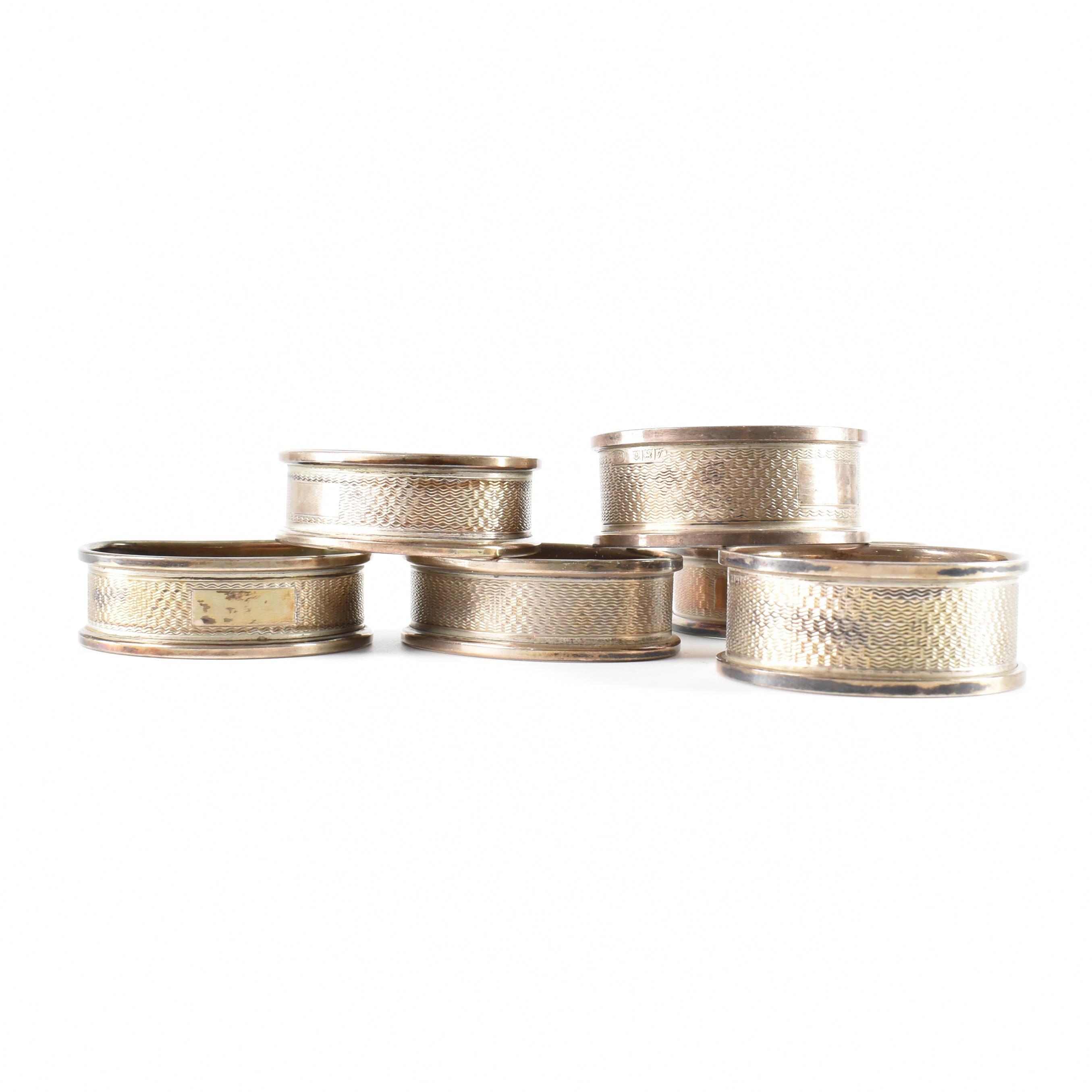SIX 20TH CENTURY HALLMARKED SILVER NAPKIN RINGS OF VARIOUS SHAPES