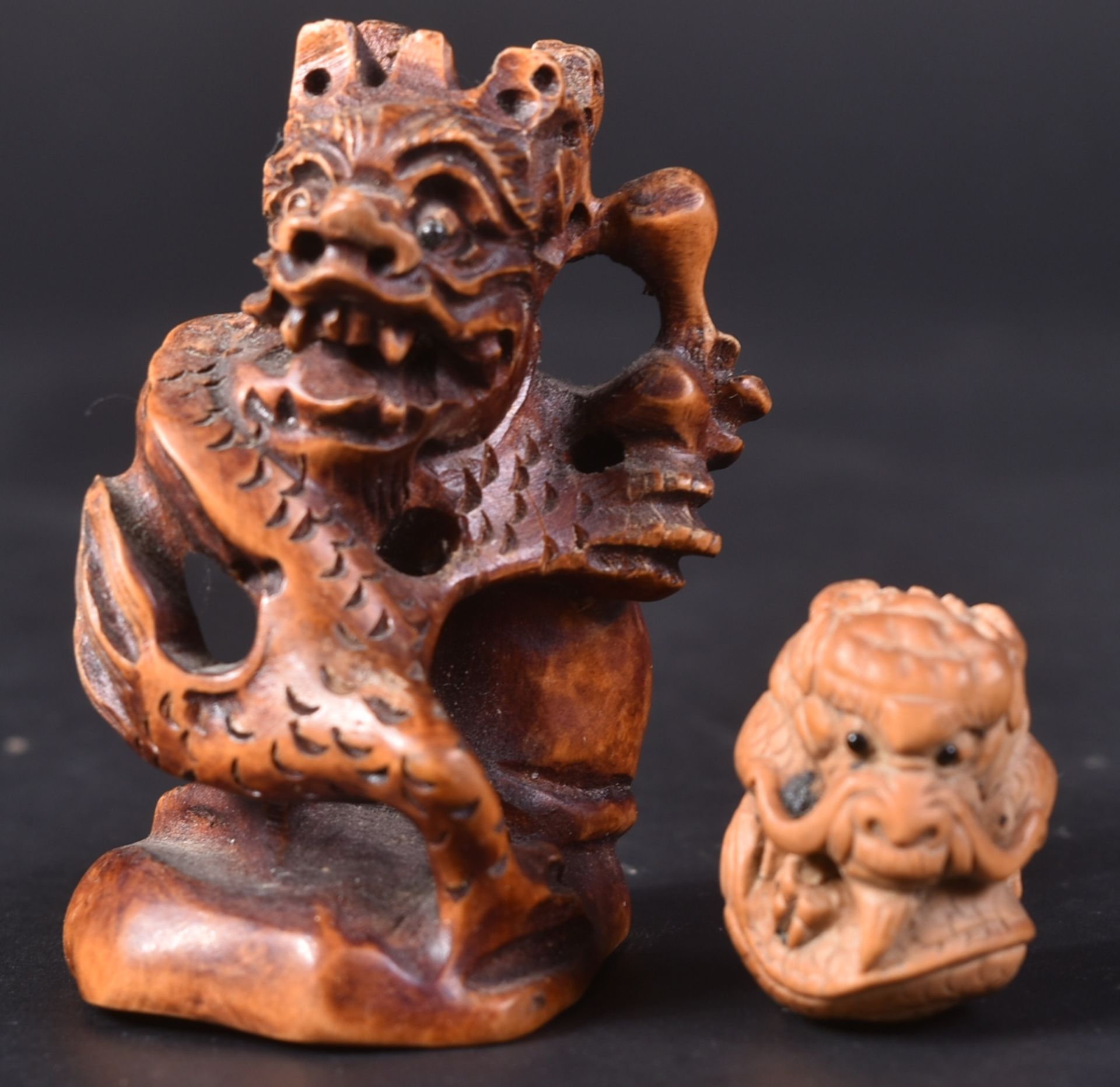 TWO JAPANESE HAND CARVED DRAGON NETSUKES