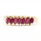 GOLD & RUBY SEVEN STONE RING