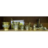 A collection of six reproduction brass mortars and pestles, largest 11.5cm high, smallest 6.5cm, a