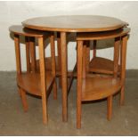 An oak circular nest of five tables, 60cm diameter and two stools, (3).