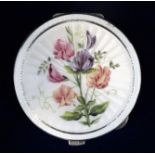 A silver circular compact, the lid enamelled with sweet peas on a cream guilloche enamel ground,