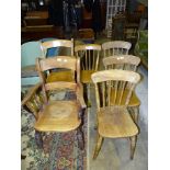 Two elm and beech lathe-back armchairs, a walnut spindle-back tub chair and four stick-back