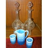 A pair of cut-glass decanters and stoppers, 34cm high and other glassware.