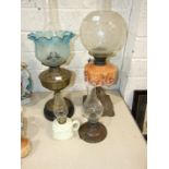 A Victorian oil lamp with moulded glass reservoir and etched glass bowl shade, 67cm high, a brass