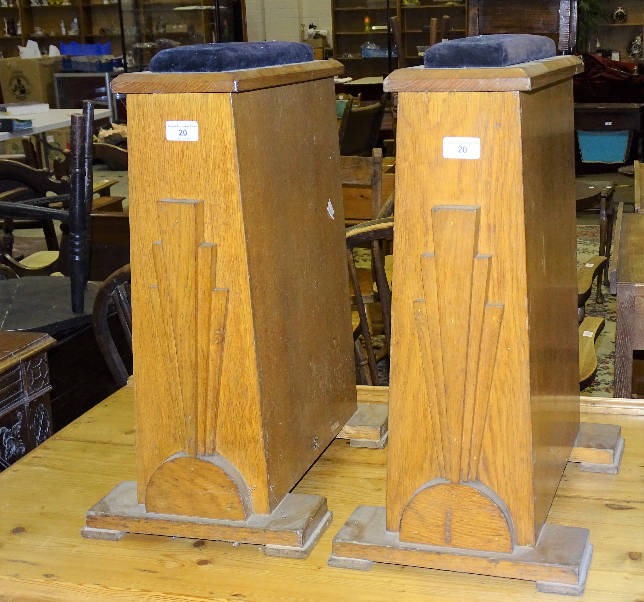 A pair of Art deco oak coffin stands, 55cm high.