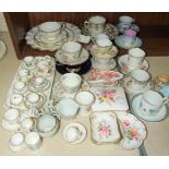 A collection of modern miniature bone china cups, saucers and plates, various Crown Derby and