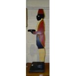 A painted wood dumb waiter wearing a fez, 93cm high.