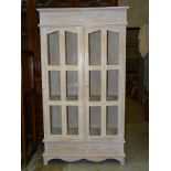 A painted hardwood two-door glazed cupboard,  93cm wide, 172cm high, and a modern painted beech