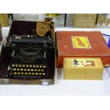 A Corona folding portable typewriter in leather carrying case, a Portrait Brownie No.2 camera, a