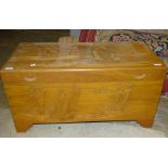 A modern Oriental camphor wood blanket chest, the hinged lid and front carved with junks, 91 x 45cm,