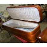 Remaining Contents of a Funeral Director's Parlour. A large mahogany casket with hinged lid and