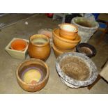 Three cast concrete garden planters, various terracotta and other garden pots.