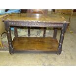 An oak two-tier side table constructed with old timber, 106cm wide, 71cm high.