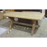 A pine scrub-top trestle-style table, 182 x 66cm.