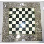 A marble chess board, 53.5 x 52.5cm.