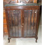 A 1950's mahogany display cabinet on short cabriole legs, 89cm wide, 119cm high.