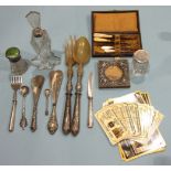 A small collection of coins, an embossed silver frame and other metal ware.