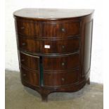 A Georgian mahogany half-round commode, converted and having four cupboard doors, on bracket feet,