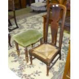 A stained wood low chair with high back and drop-in rush seat and an upholstered seat stool on