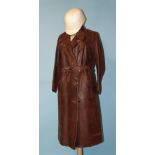 A vintage lady's tan soft leather coat used for motorcycling, with stand-up collar and parallel-