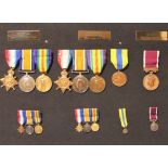 A WWI and later family group of medals: 1914-15 Star, British War and Victory medals to Sgt G H