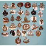 A collection of thirty-two various military badges.
