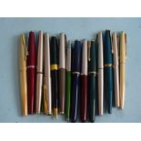 A collection of nine Parker fountain pens, including 'Junior', 'Victory', '45', two ballpoint pens