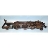 A 2½'' gauge 2-6-2 locomotive chassis, with gear lever, pistons and buffers, 61cm long.