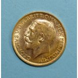 A George V 1911 gold sovereign.