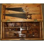 A composed collection of woodworking planes and other woodworking tools, including twenty-one