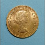 An Elizabeth II 1958 gold sovereign.