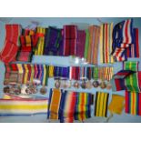 Three groups of medal miniatures and a quantity of medal ribbons.