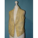 A Victorian gentleman's ivory silk waistcoat, the revers and front embroidered in cream silk with