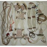 A collection of Oceanic bead and shell-work belts, necklaces and bangles.